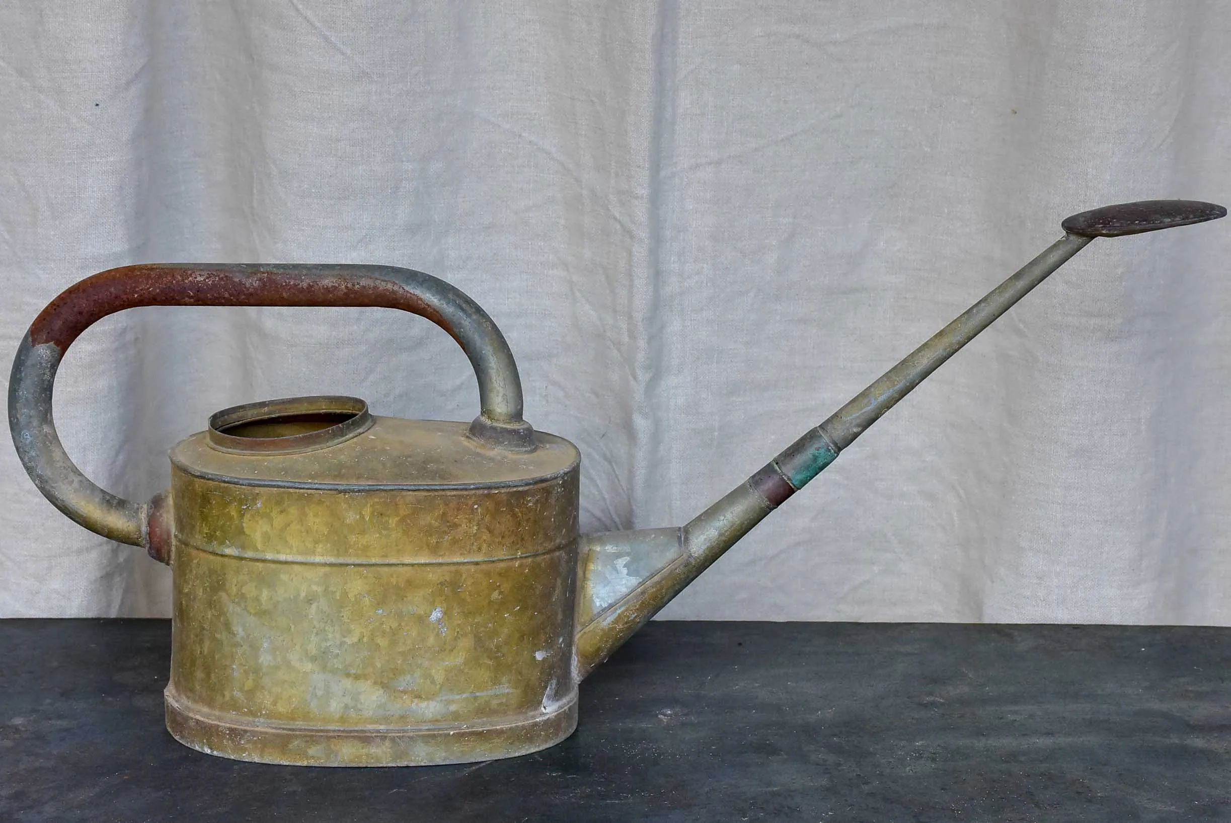 Antique French watering can with long spout