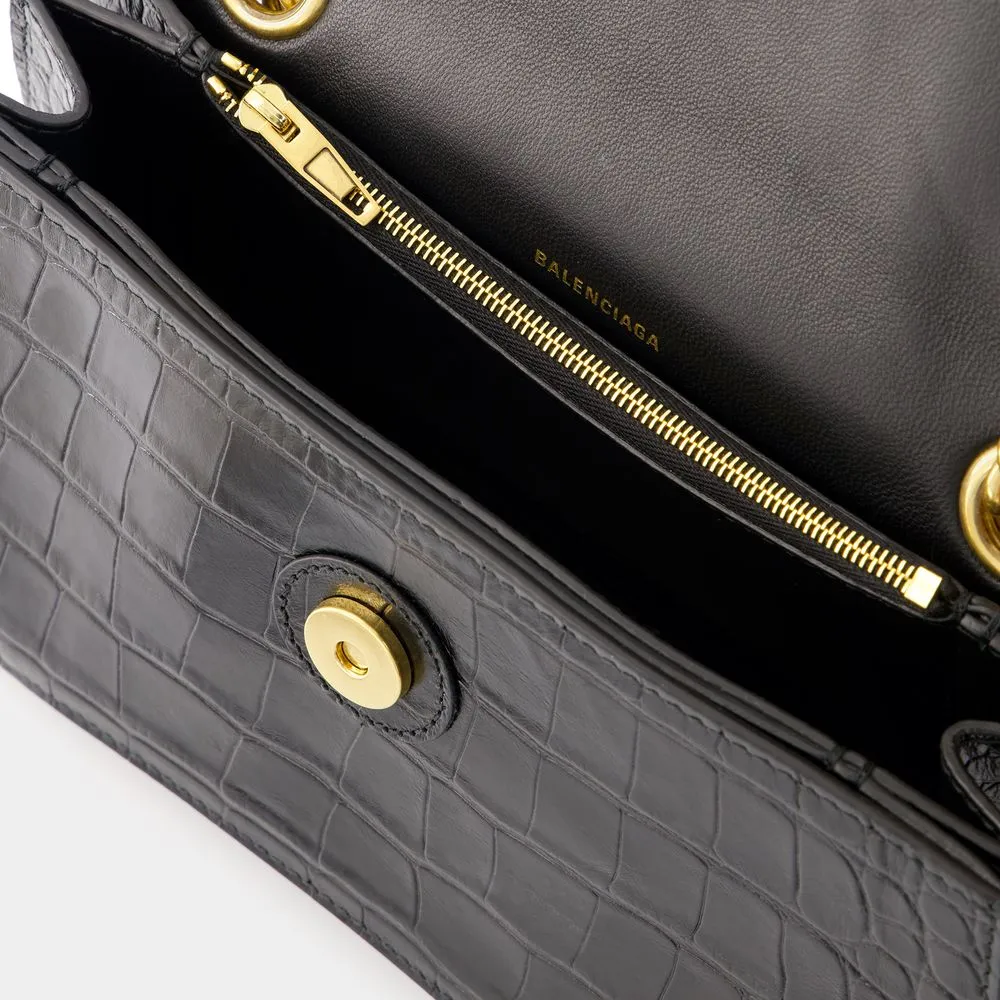 BALENCIAGA CRUSH CHAIN SMALL BAG IN CROCODILE-EMBOSSED LEATHER.  DIMENSIONS: L24.9 X H14 X W7.9 CM.  49.8 CM LONG CHAIN SHOULDER STRAP.  CURVILINEAR BOTTOM.  AGED GOLD FINISH.  STUDDED MAGNET