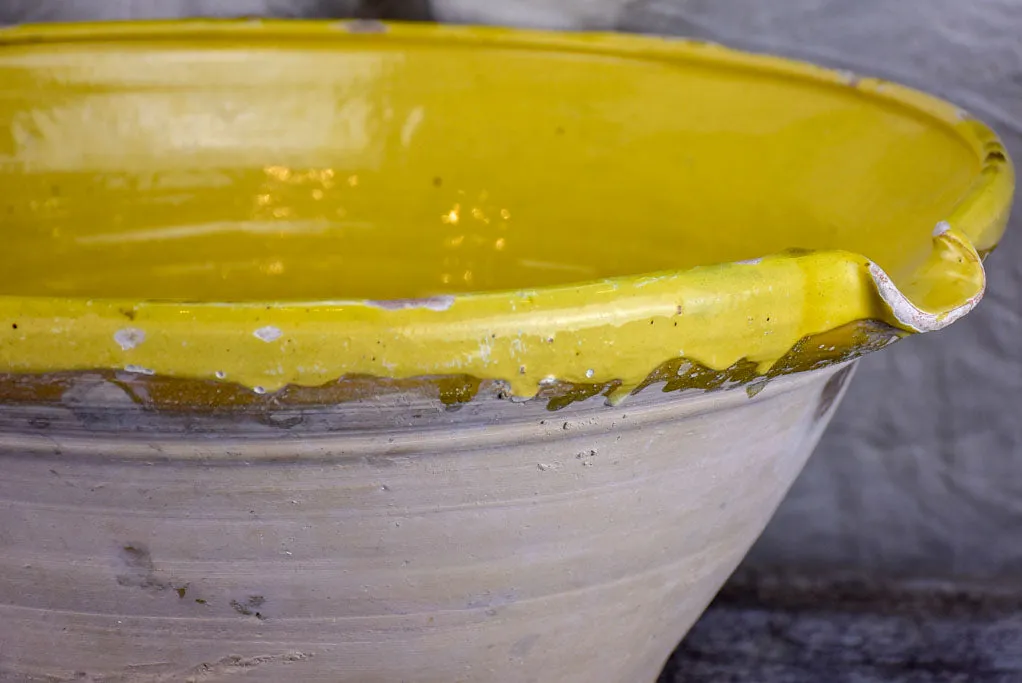 Large antique French 'tian' bowl with yellow glaze