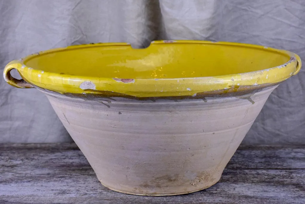 Large antique French 'tian' bowl with yellow glaze
