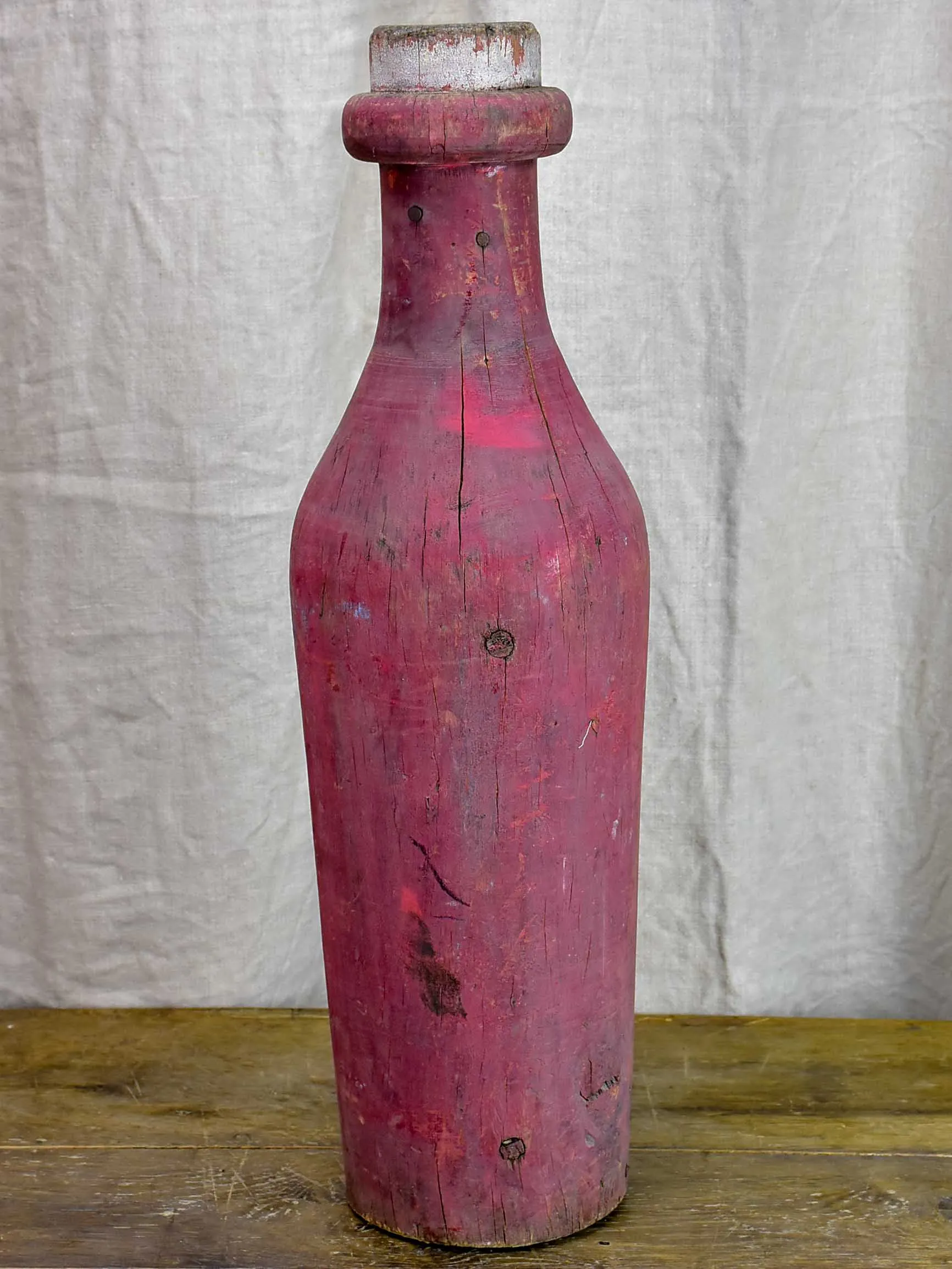 Oversize wooden Morgan bottle sculpture from Beaujolais