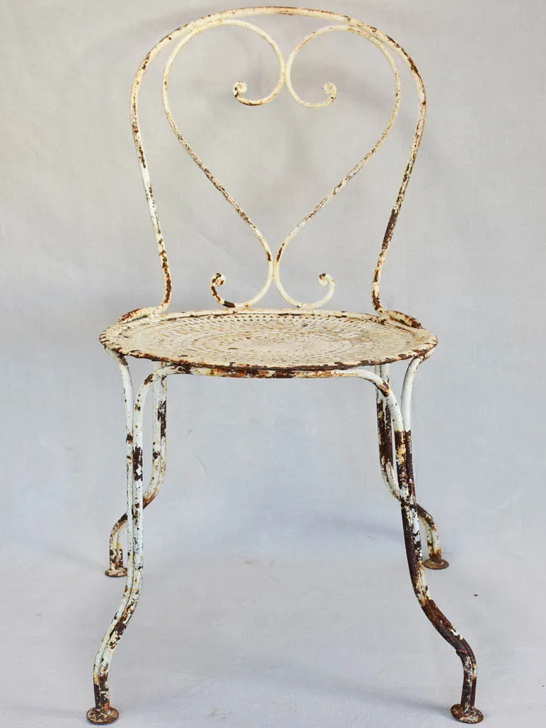 Pair of early twentieth century French garden chairs with white patina