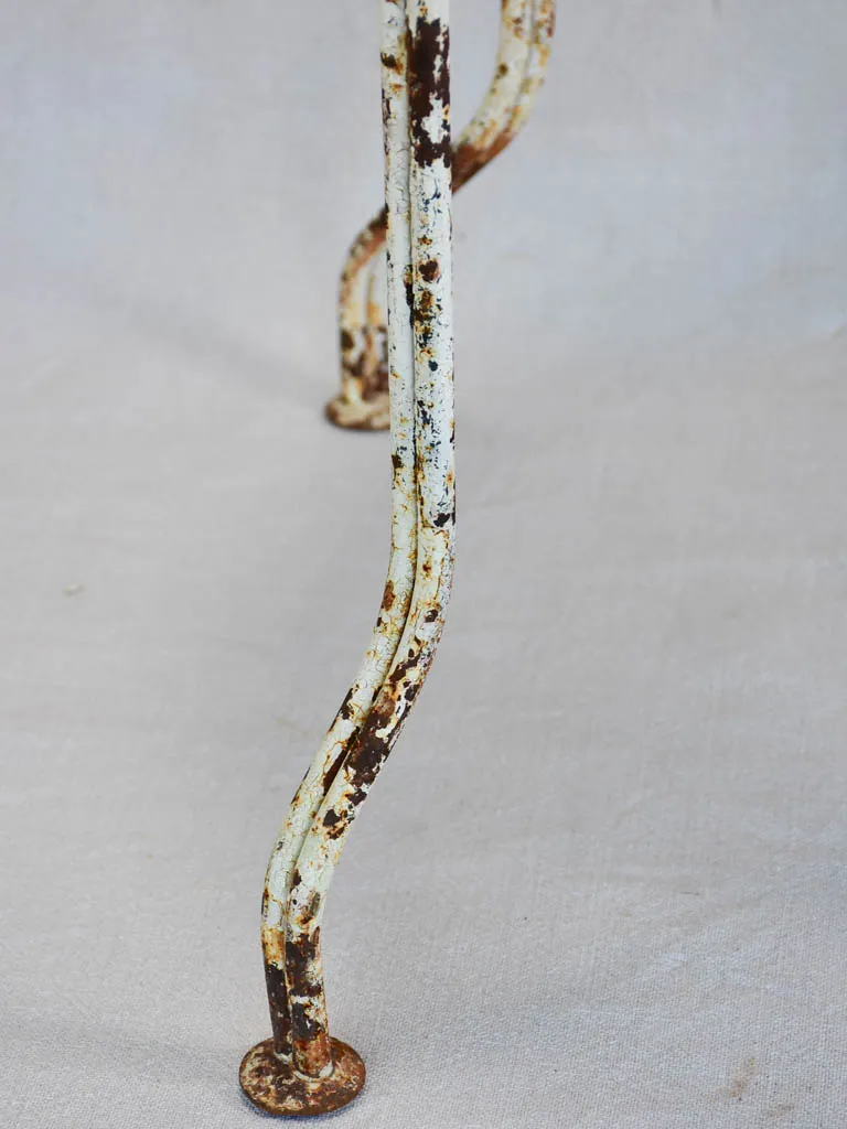 Pair of early twentieth century French garden chairs with white patina