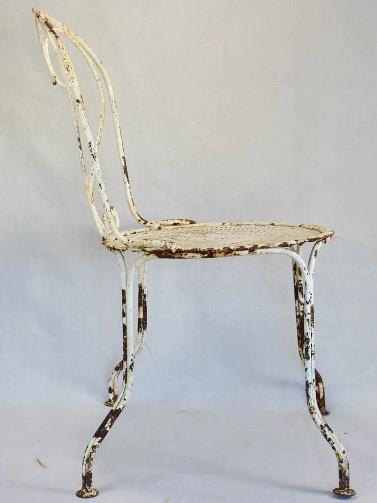 Pair of early twentieth century French garden chairs with white patina