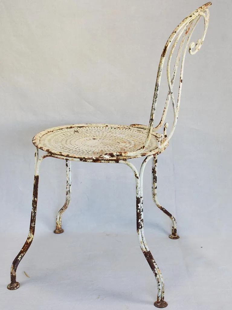 Pair of early twentieth century French garden chairs with white patina