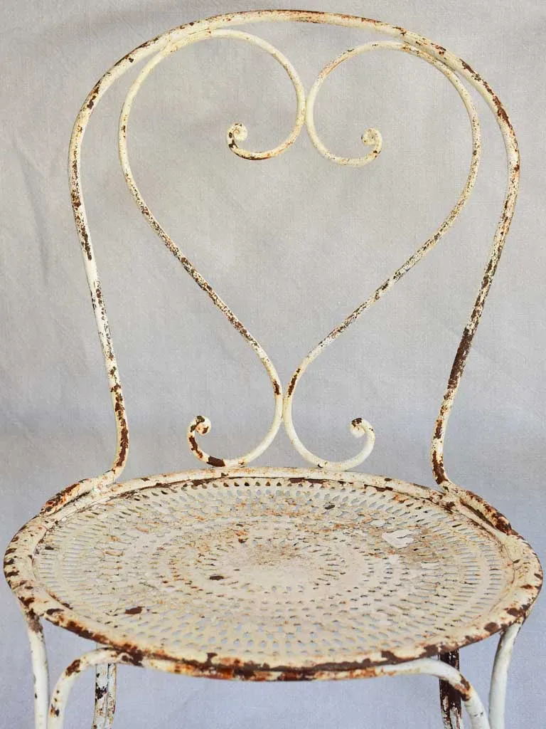 Pair of early twentieth century French garden chairs with white patina