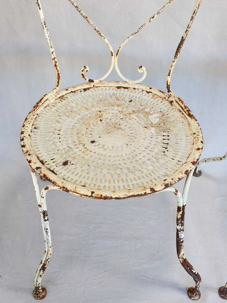 Pair of early twentieth century French garden chairs with white patina
