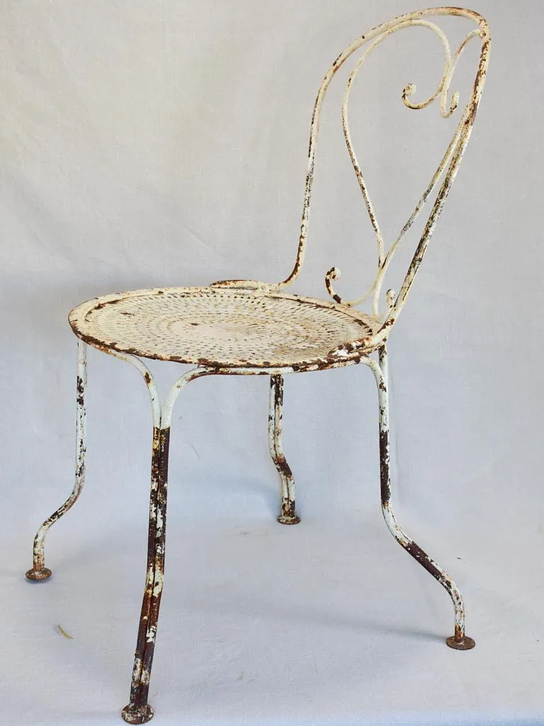 Pair of early twentieth century French garden chairs with white patina