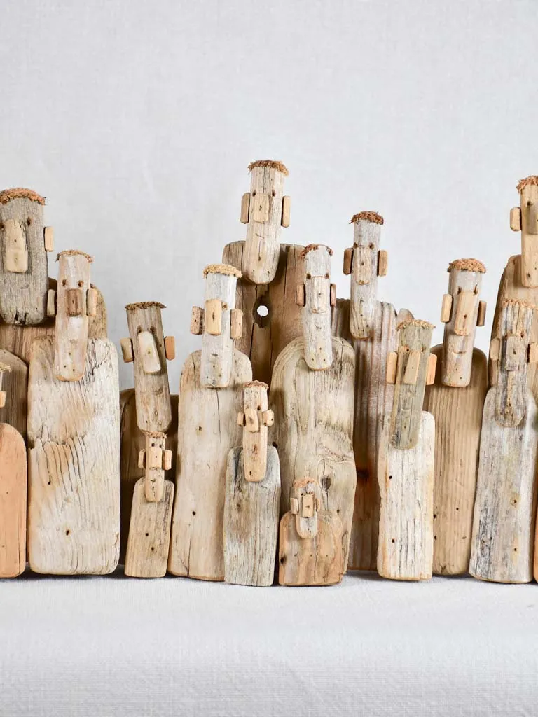Panoramic driftwood sculpture by JP Dreano - 34 characters 27½"